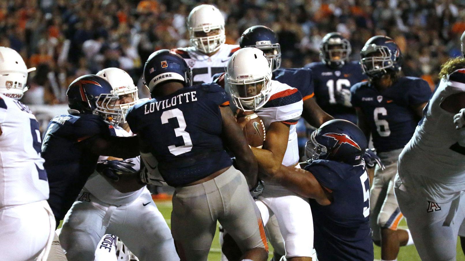 As a runner, Arizona Wildcats QB Brandon Dawkins seeks balance between aggression and discretion
